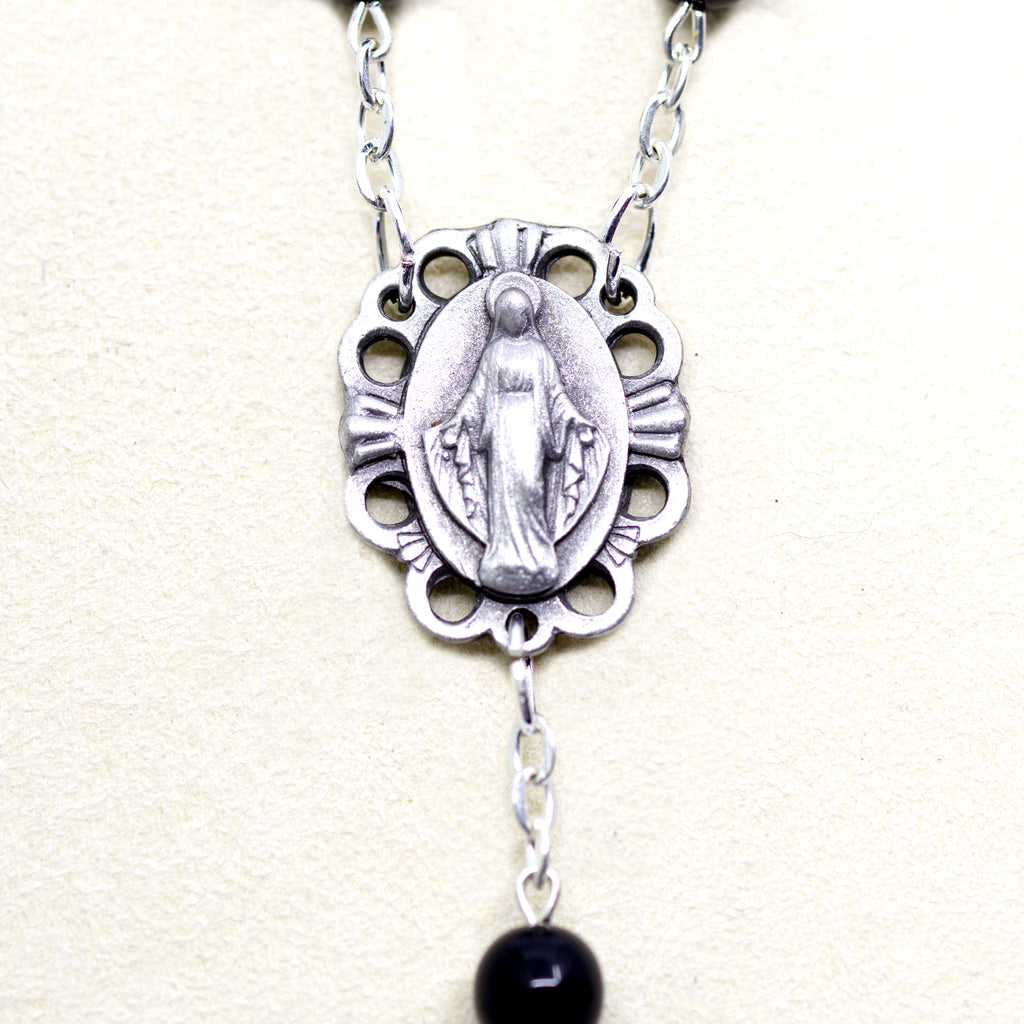 Black rosary with a relic from Jerusalem