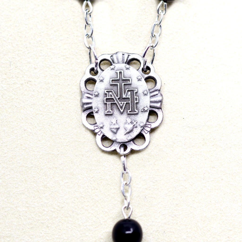 Black rosary with a relic from Jerusalem